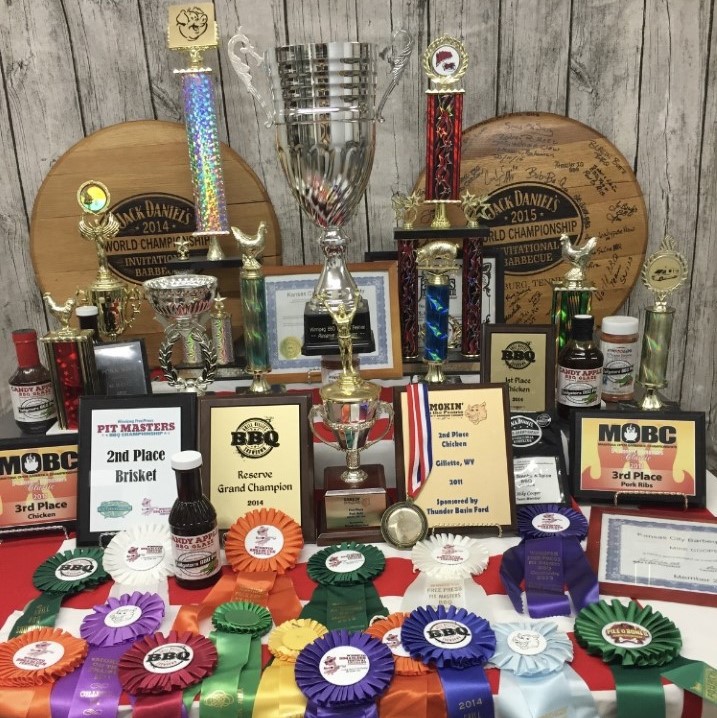 Table full of awards displayed
